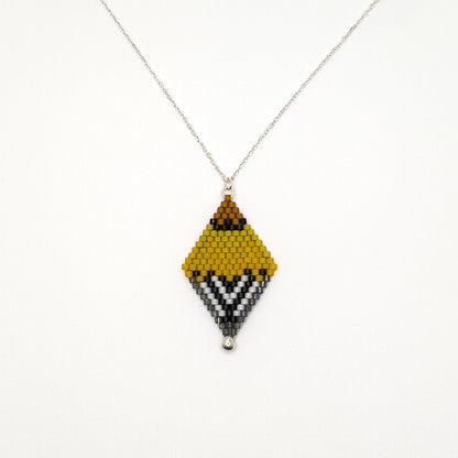 Handcrafted beaded pendant with a sterling silver chain inspired by the American Goldfinch, featuring vibrant yellow, black, and white beads displayed on a white background.