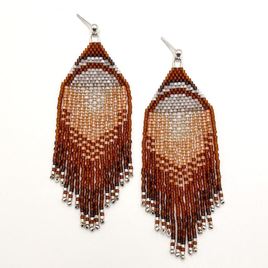 Beaded earrings with a gradient design on a white background